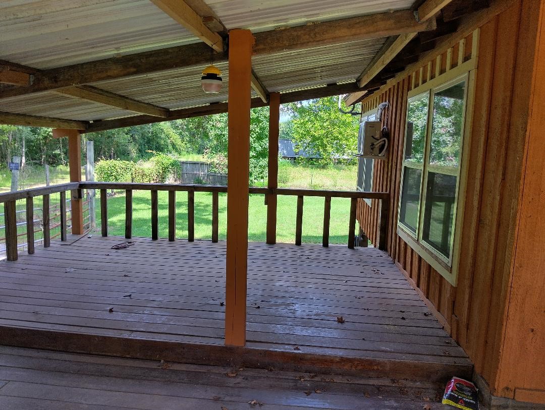 260 County Road 360 Splendora, TX 77372 - Photo 8 of 15 a view of a wooden deck