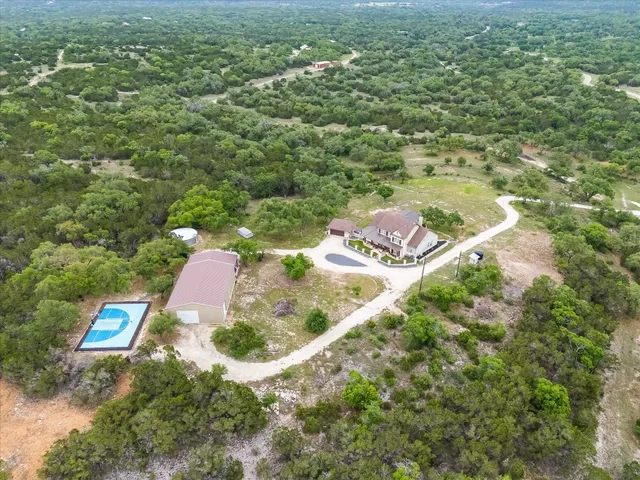 an aerial view of residential house with outdoor space