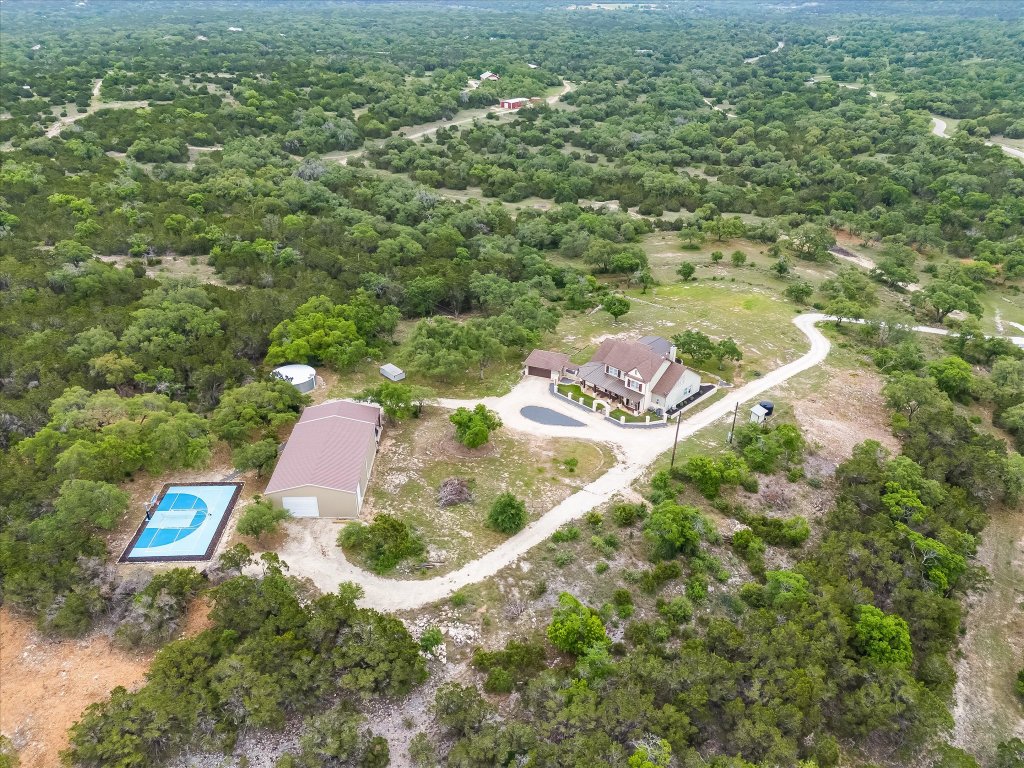 an aerial view of residential house with outdoor space