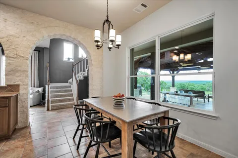 a view of a dining room with furniture window and outside view
