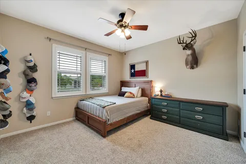 a living room with bed and a chandelier