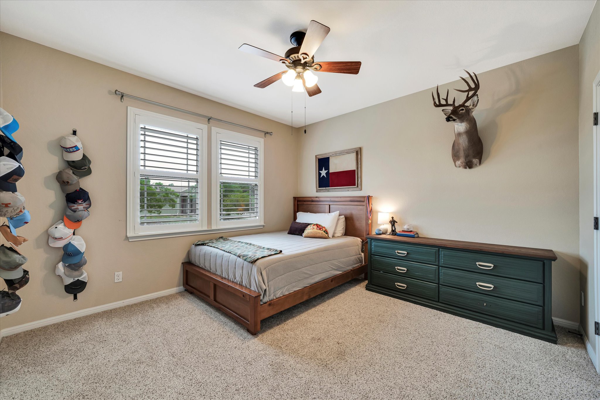 440 Currie Ranch Road Wimberley, TX 78676 - Photo 23 of 40 a living room with bed and a chandelier