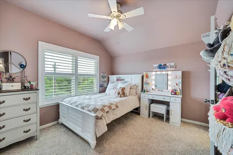 a bed room with a bed and a window