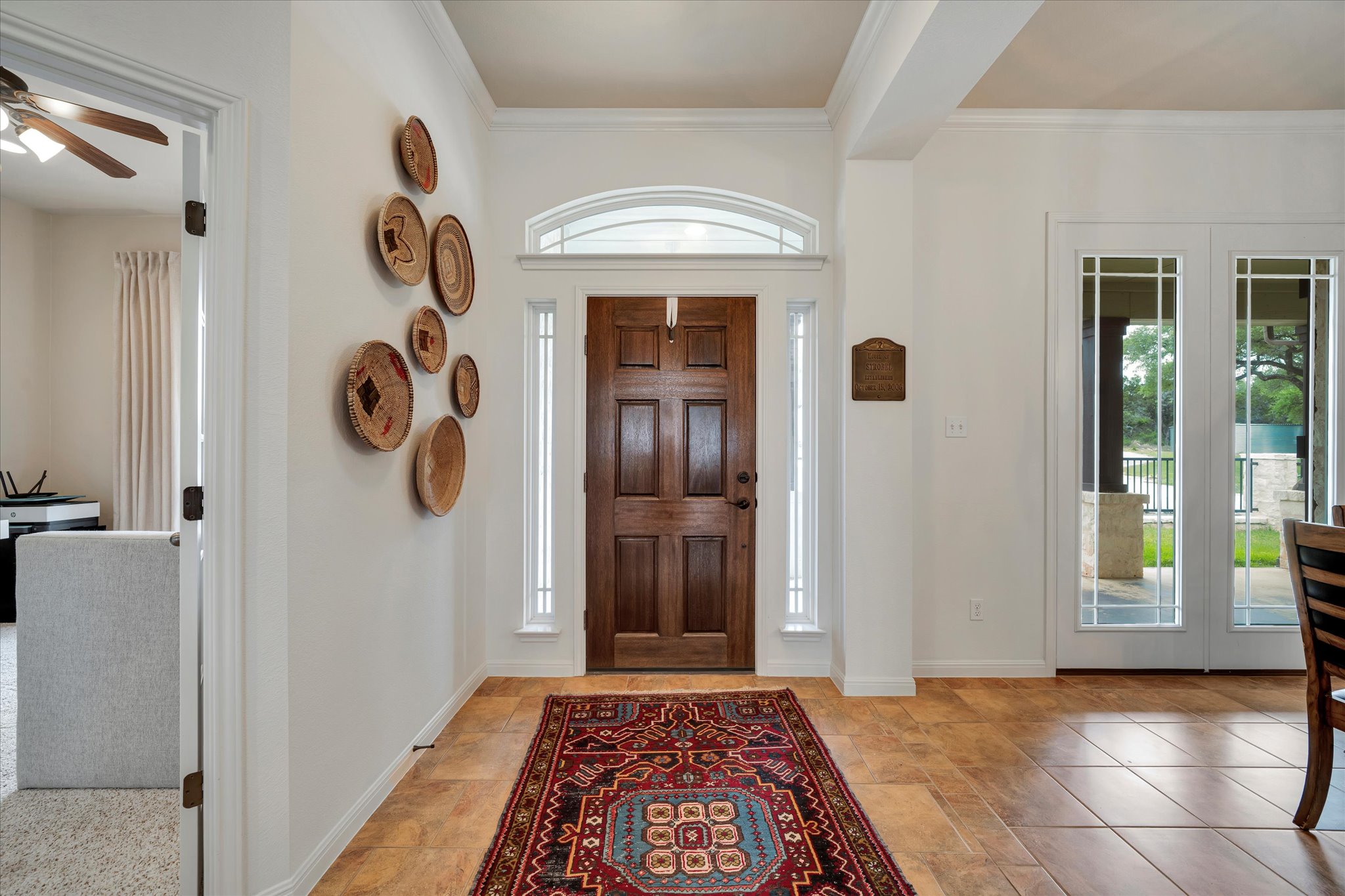 440 Currie Ranch Road Wimberley, TX 78676 - Photo 4 of 40 a view of a hallway to a bedroom with windows
