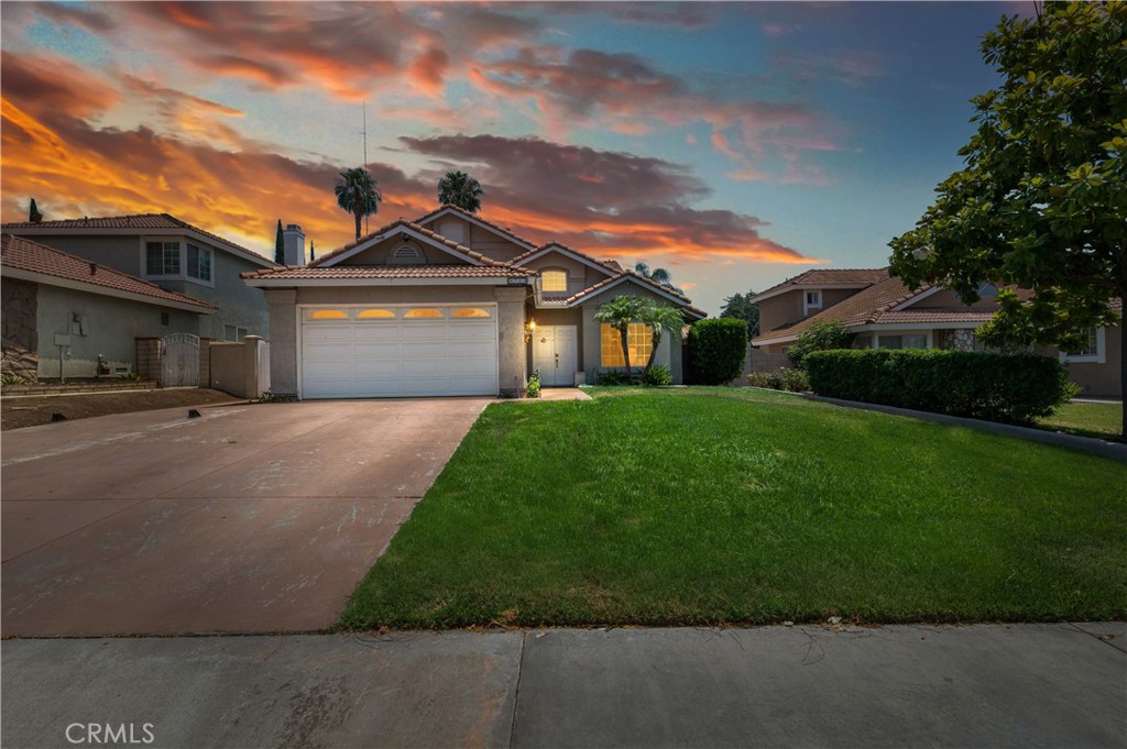 8744 Sandhill Drive Riverside, CA 92508 - Photo 1 of 1 a front view of a house with a garden and yard