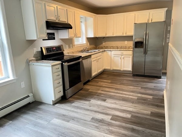 34 Sherbert Road Ashburnham, MA 01430 - Photo 4 of 20 a kitchen with a refrigerator sink and cabinets