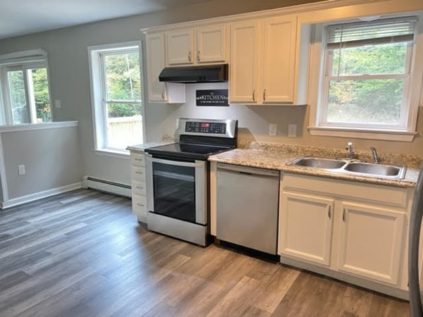 34 Sherbert Road Ashburnham, MA 01430 - Photo 5 of 20 a kitchen with granite countertop wooden floors appliances and sink