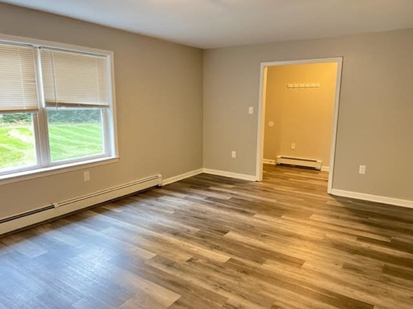 34 Sherbert Road Ashburnham, MA 01430 - Photo 8 of 20 an empty room with wooden floor and windows