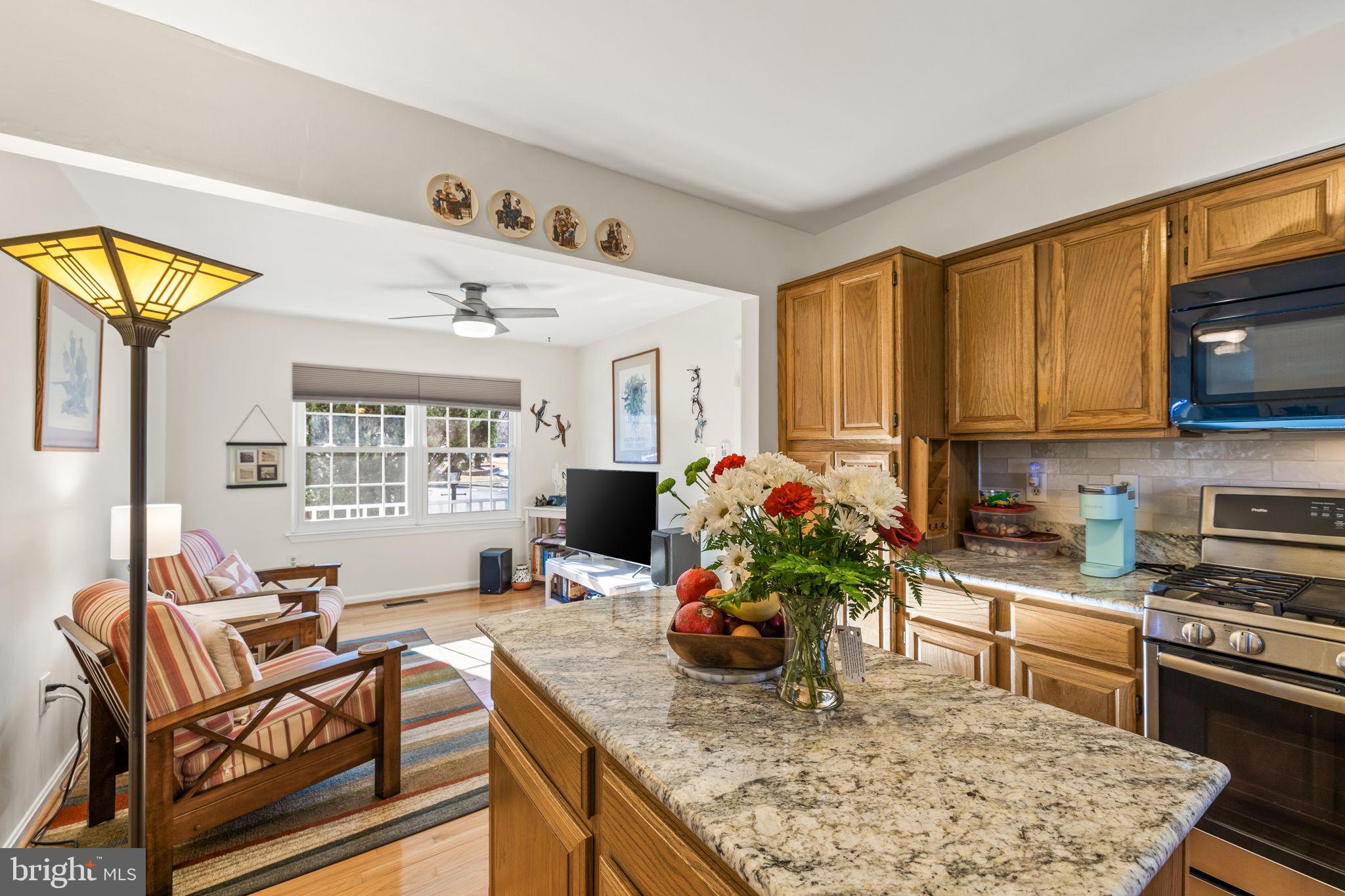 13911 Ruler Court Woodbridge, VA 22193 - Photo 13 of 38 a kitchen with a stove a sink and a refrigerator