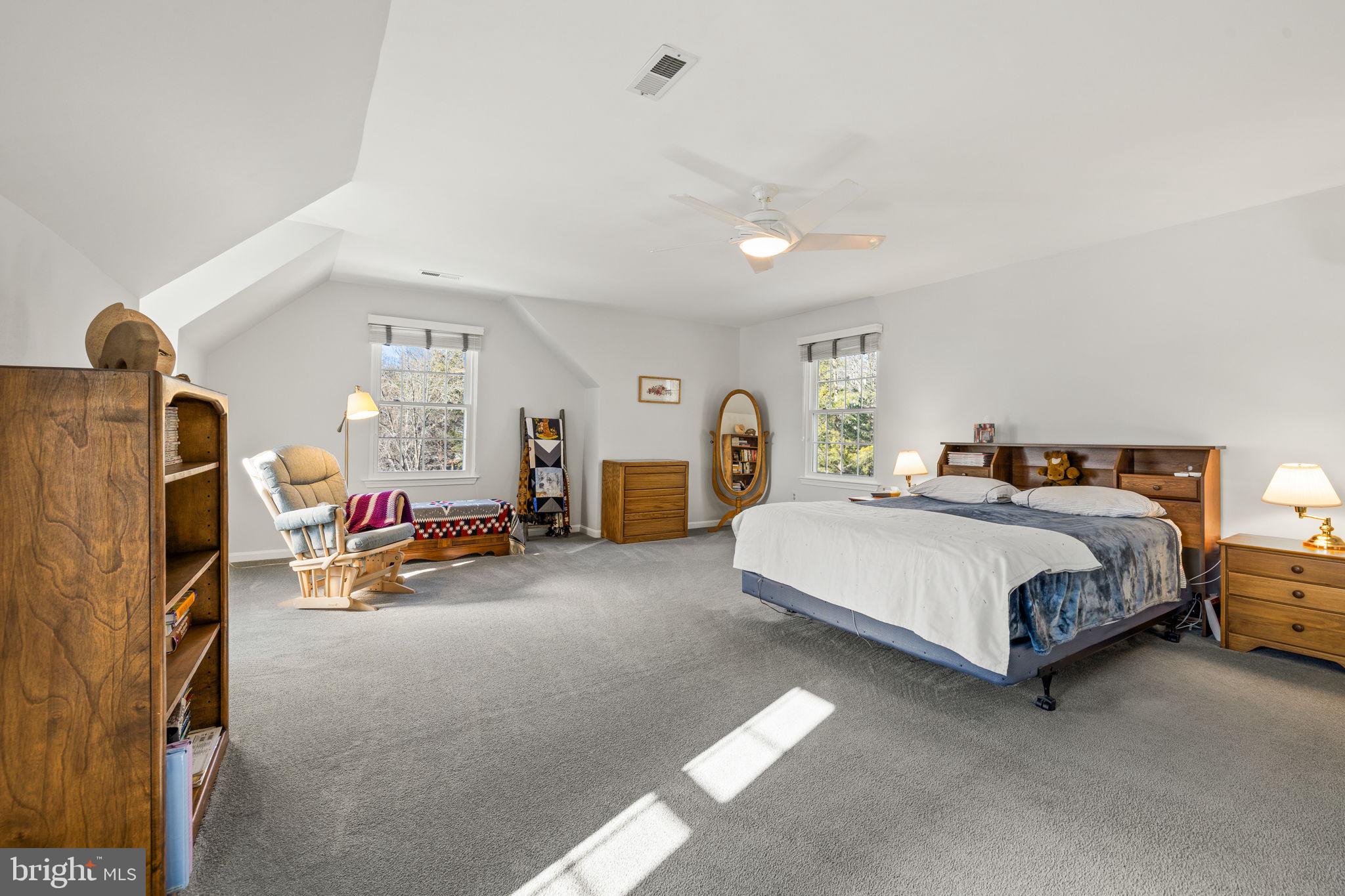 13911 Ruler Court Woodbridge, VA 22193 - Photo 20 of 38 a bedroom with bed and a couch