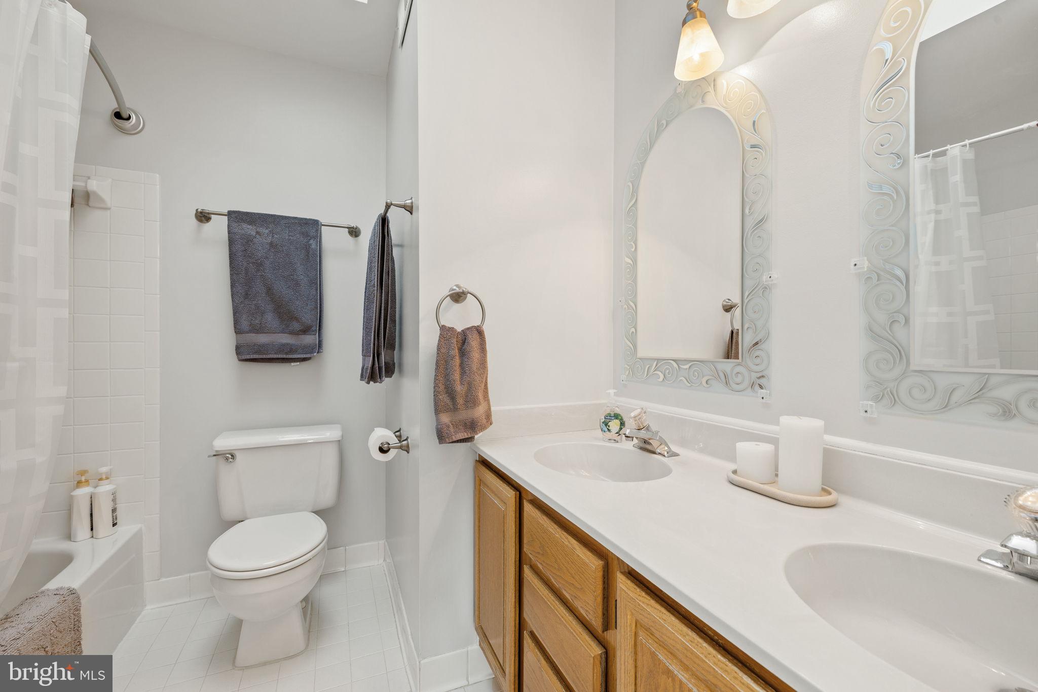 13911 Ruler Court Woodbridge, VA 22193 - Photo 22 of 38 a bathroom with a sink toilet and shower
