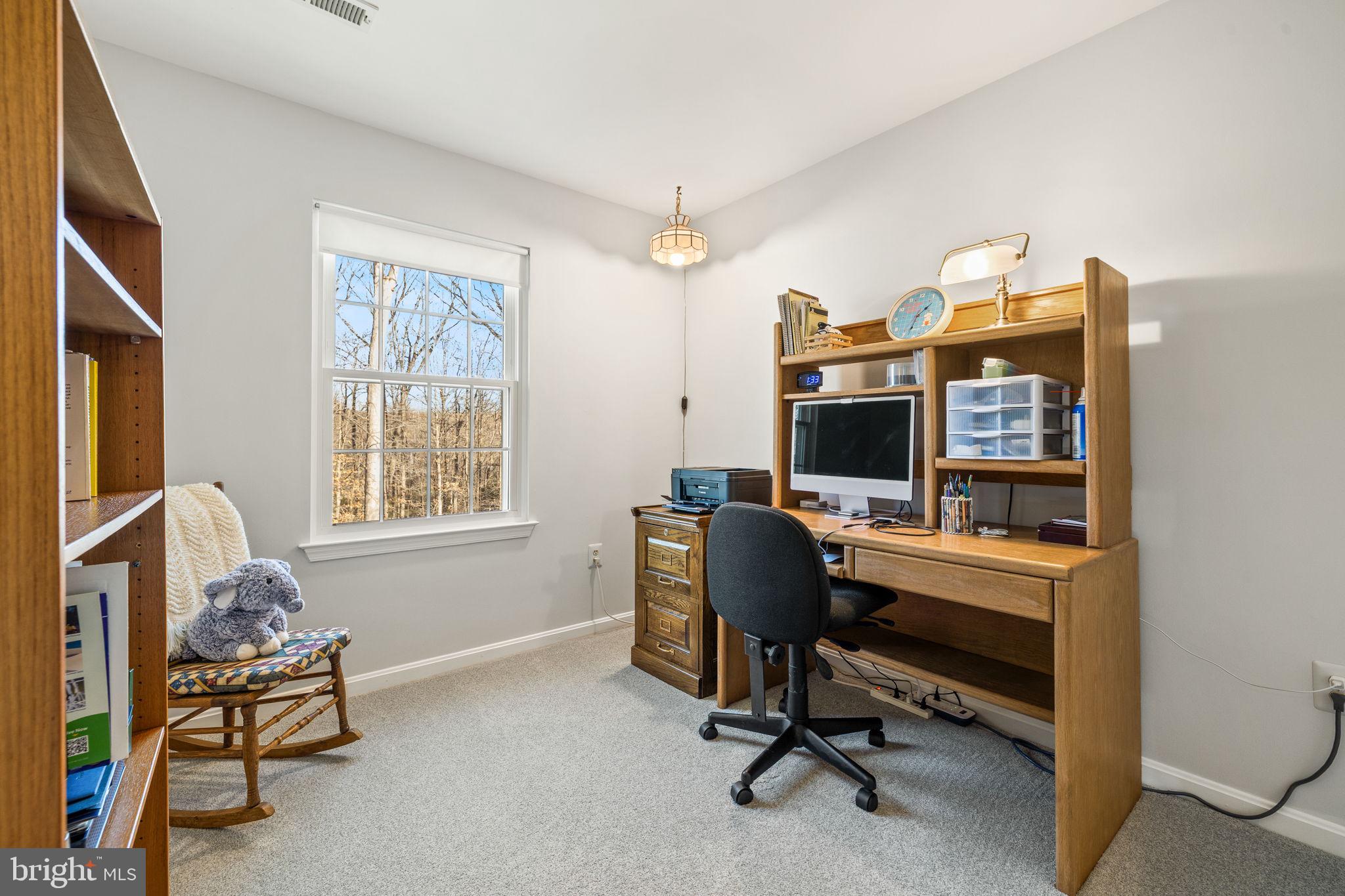 13911 Ruler Court Woodbridge, VA 22193 - Photo 25 of 38 a view of a workspace with furniture and a window