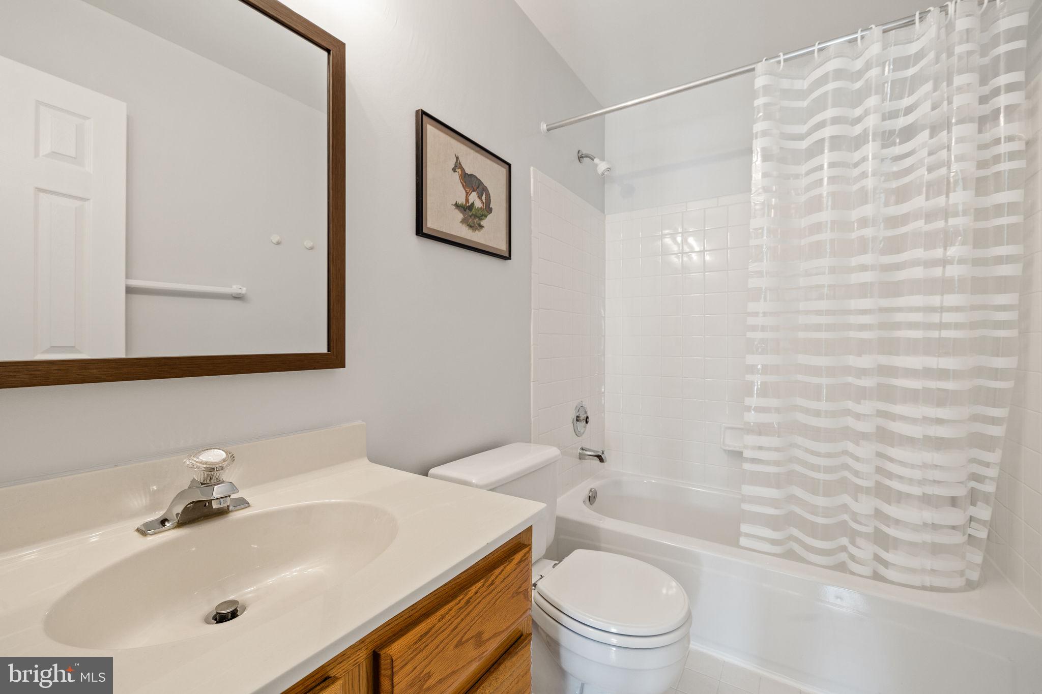 13911 Ruler Court Woodbridge, VA 22193 - Photo 26 of 38 a bathroom with a sink a toilet and shower