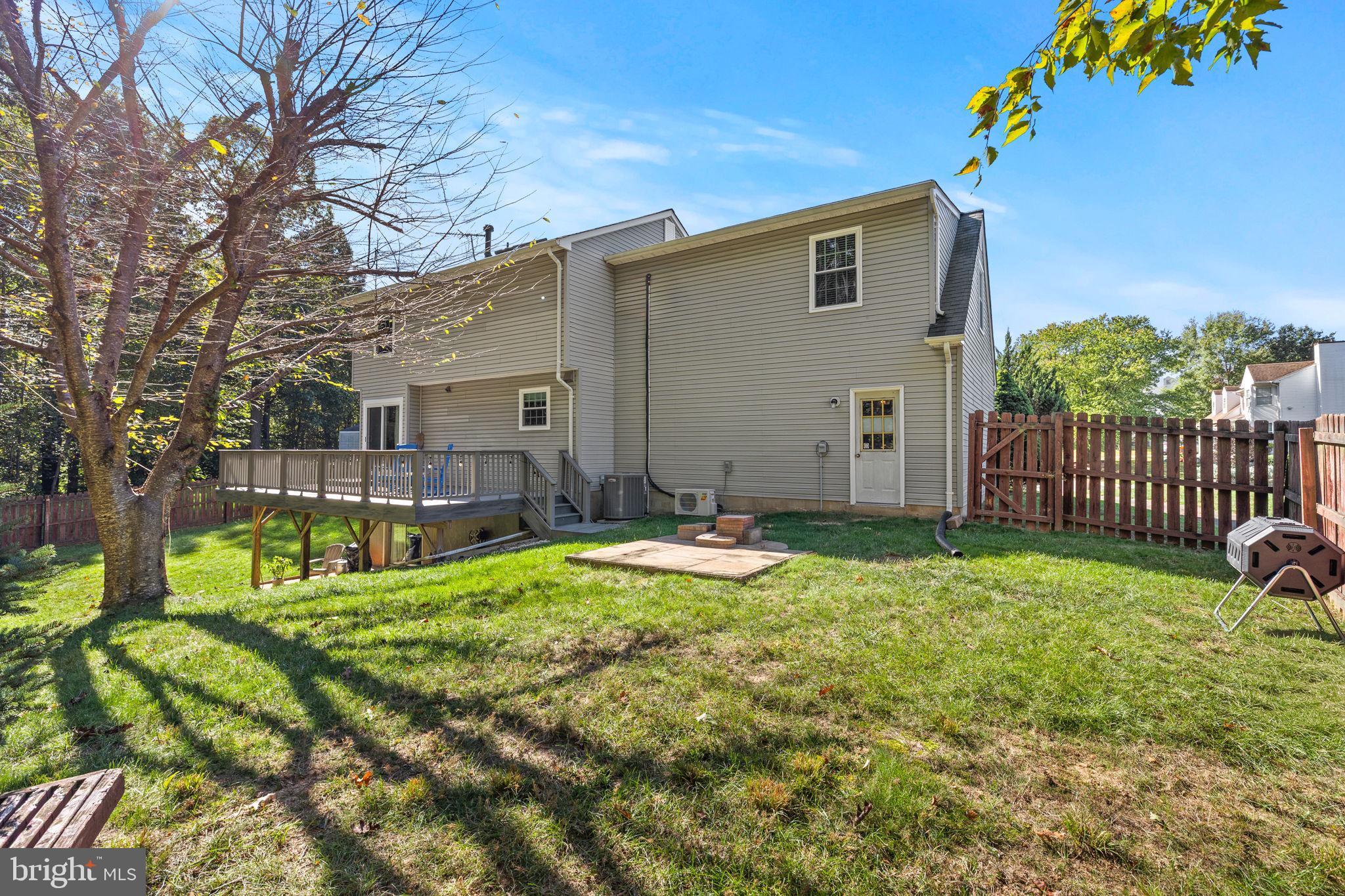 13911 Ruler Court Woodbridge, VA 22193 - Photo 31 of 38 a view of a house with backyard and sitting area