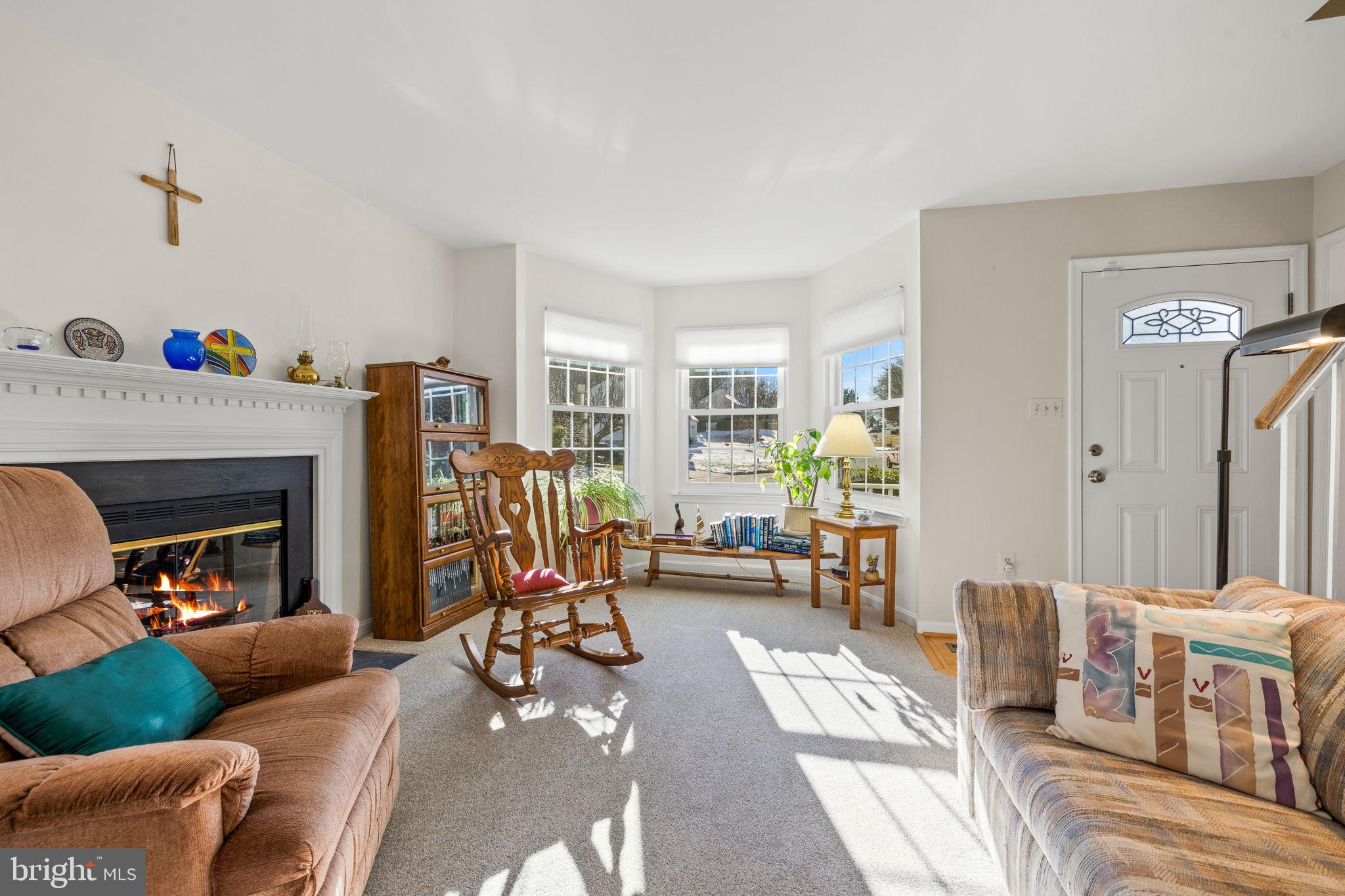 13911 Ruler Court Woodbridge, VA 22193 - Photo 7 of 38 a living room with furniture and a fireplace