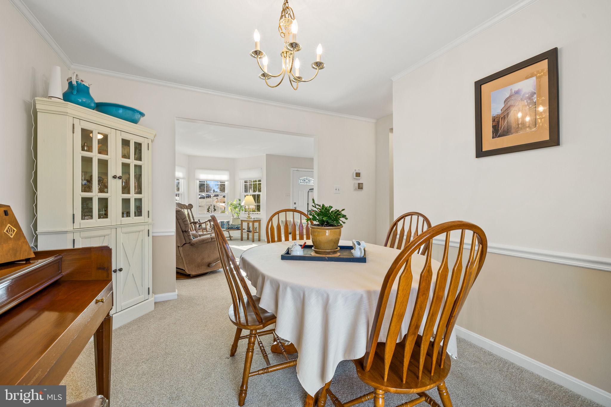 13911 Ruler Court Woodbridge, VA 22193 - Photo 9 of 38 a dining room with furniture and window