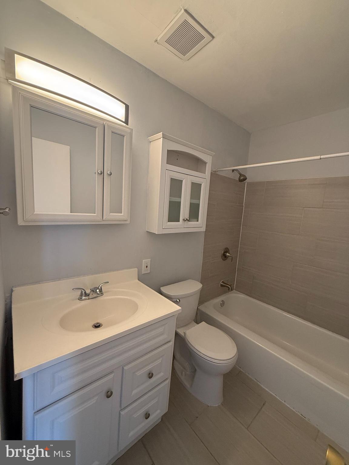 1294 Cooper Street, Unit A10 Edgewater Park, NJ 08010 - Photo 19 of 22 a bathroom with a sink a toilet and shower