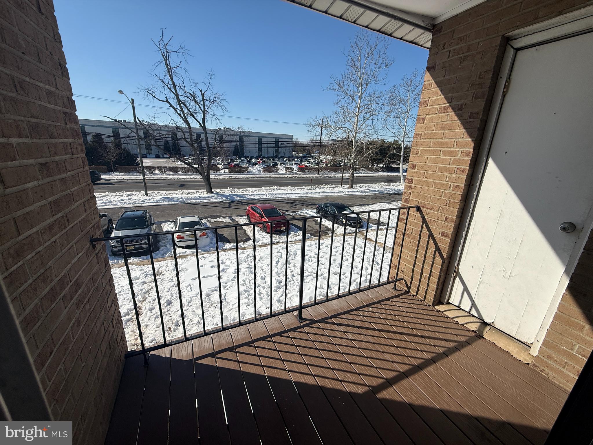 1294 Cooper Street, Unit A10 Edgewater Park, NJ 08010 - Photo 21 of 22 a view of balcony with wooden floor and fence