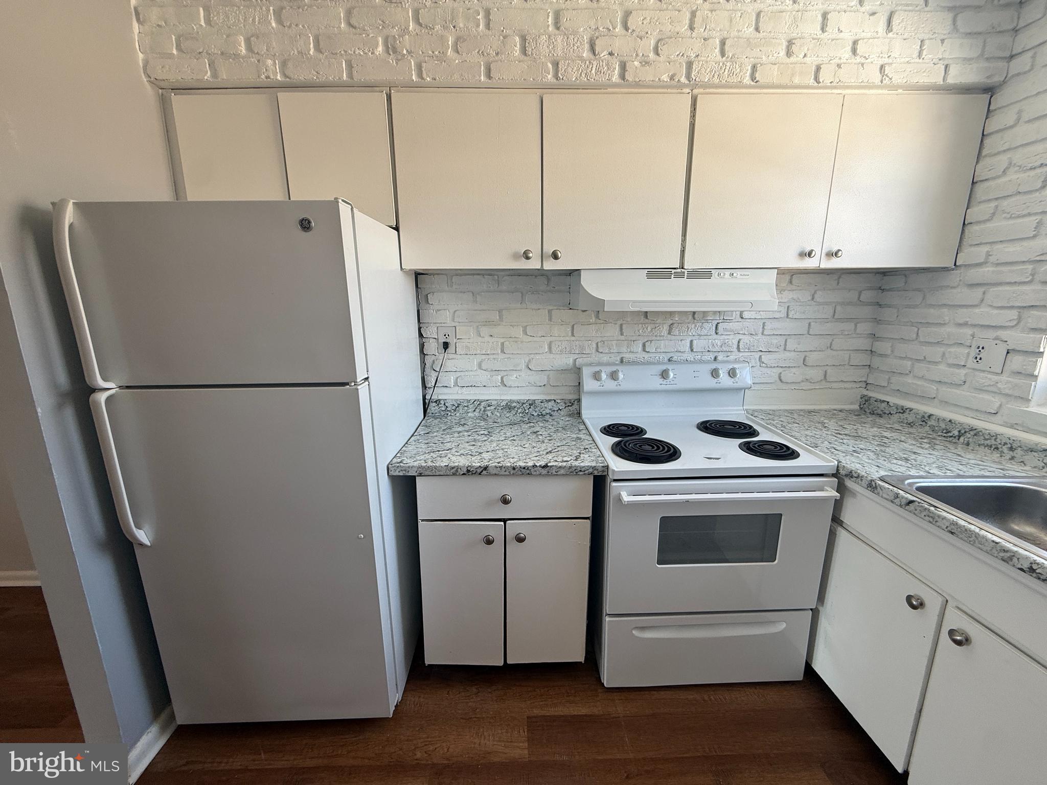 1294 Cooper Street, Unit A10 Edgewater Park, NJ 08010 - Photo 3 of 22 a white refrigerator freezer sitting inside of a kitchen