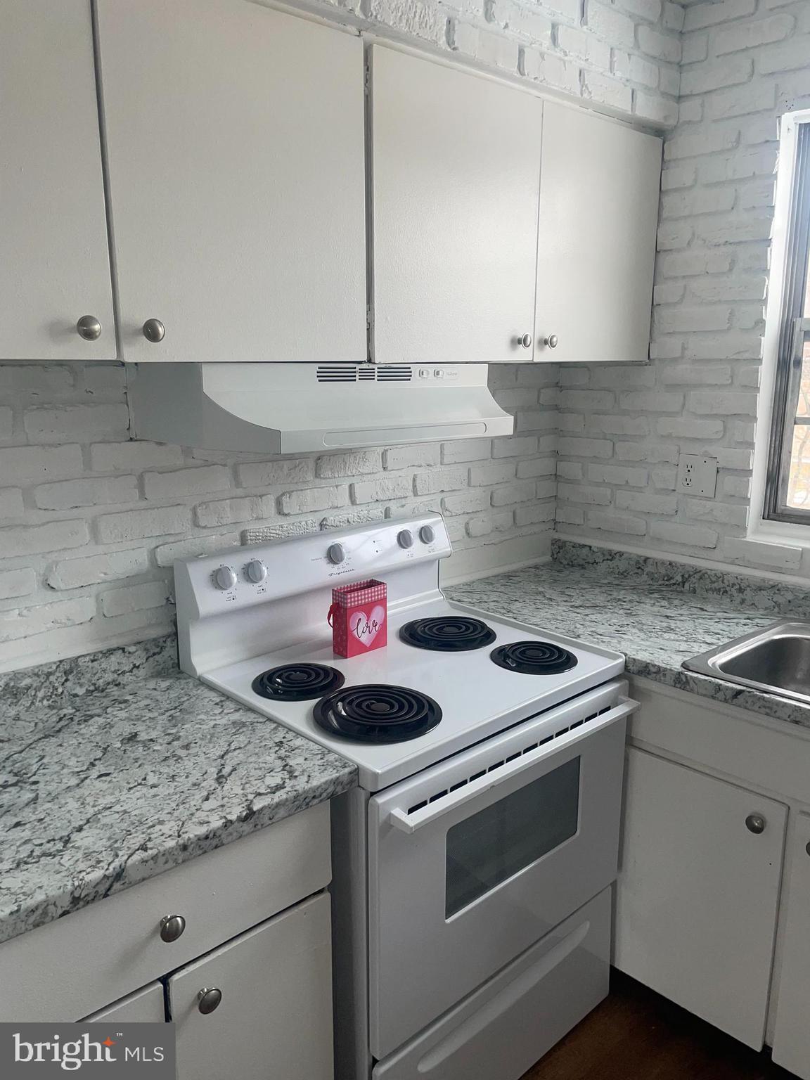 1294 Cooper Street, Unit A10 Edgewater Park, NJ 08010 - Photo 5 of 22 a kitchen with a stove and cabinets