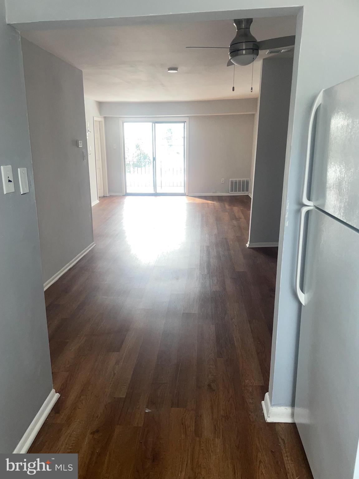 1294 Cooper Street, Unit A10 Edgewater Park, NJ 08010 - Photo 8 of 22 wooden floor in an empty room with a window