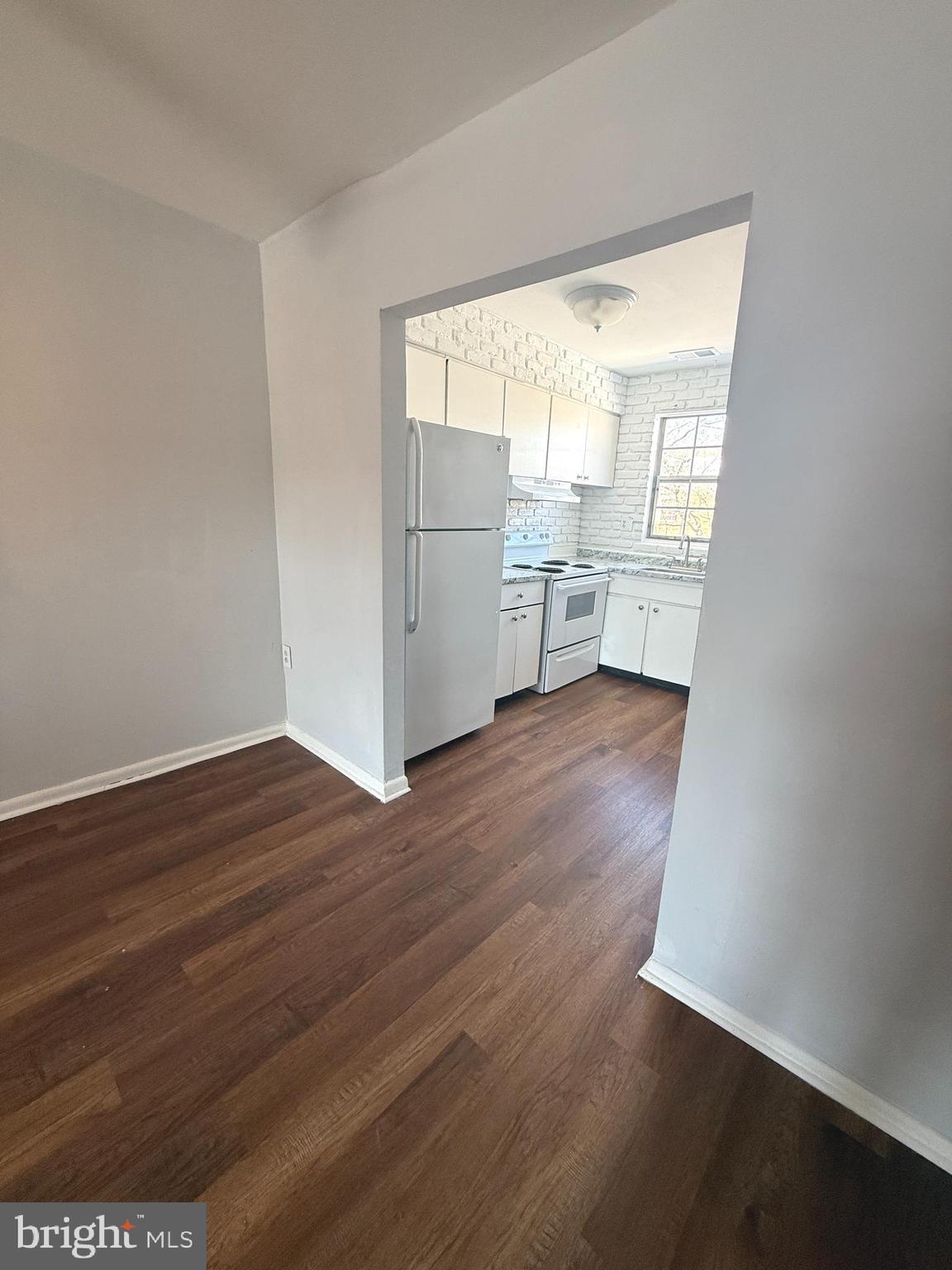 1294 Cooper Street, Unit A10 Edgewater Park, NJ 08010 - Photo 10 of 22 a view of a big room with wooden floor and windows
