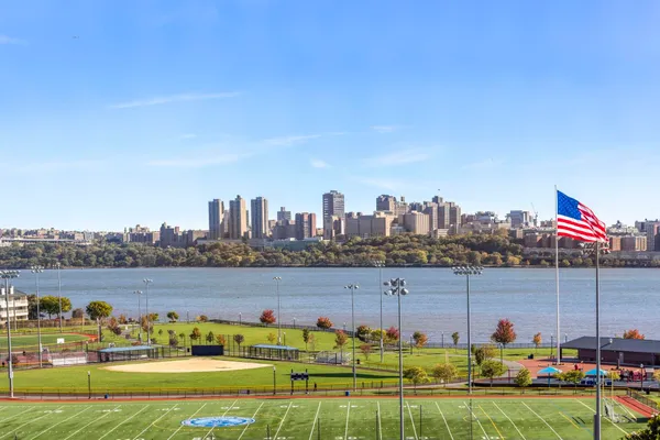 a bathroom with a sink mirror and toilet