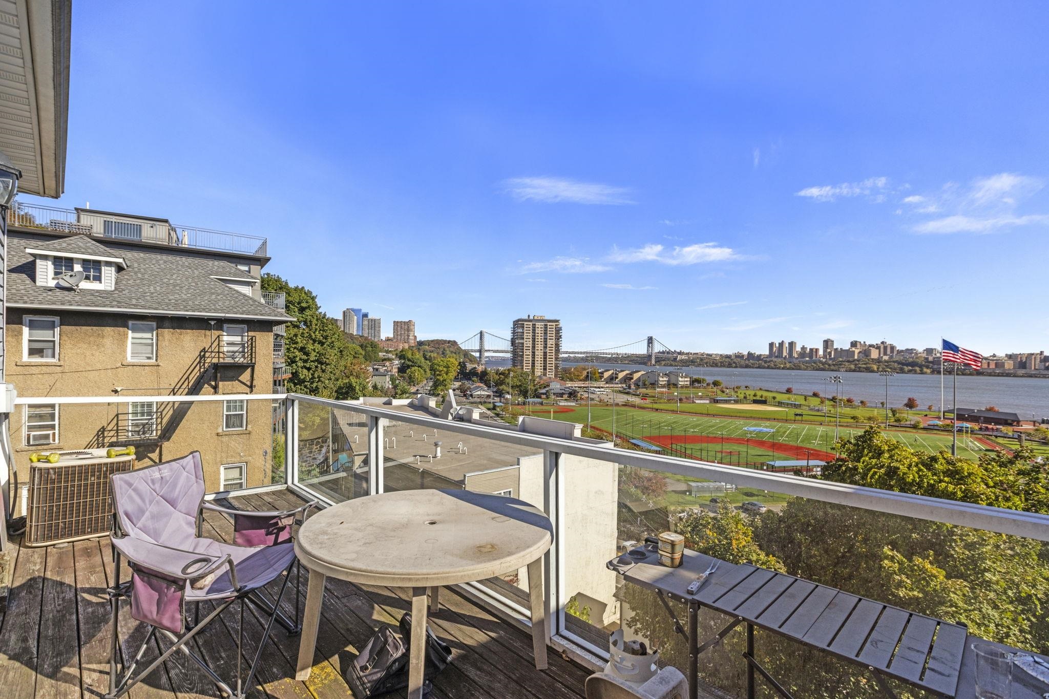 67 Highway 5 Edgewater, NJ 07020 - Photo 15 of 23 a view of a chairs and table in the terrace