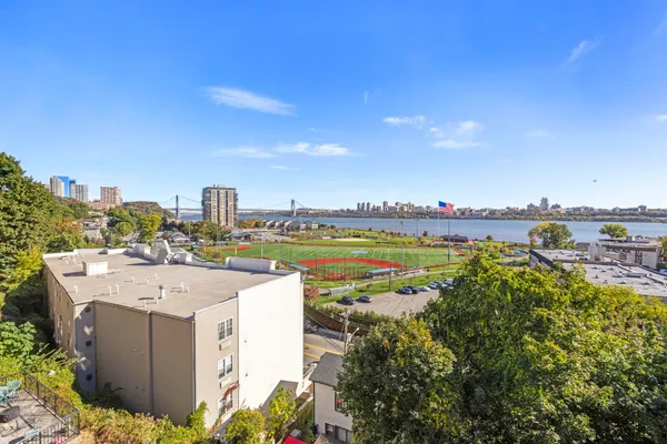 a view of balcony with wooden fence