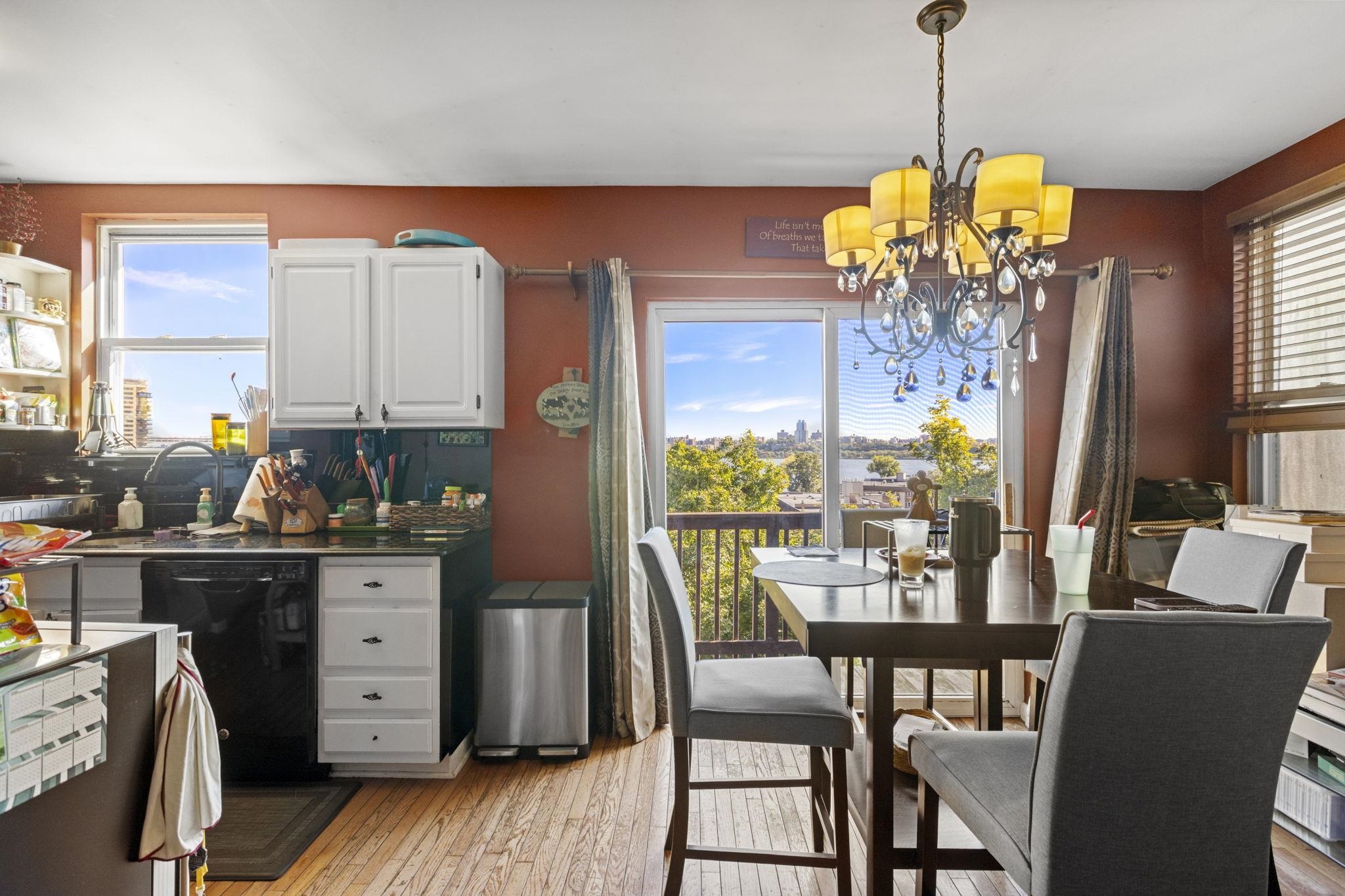 67 Highway 5 Edgewater, NJ 07020 - Photo 2 of 23 a view of a dining room with furniture window and wooden floor