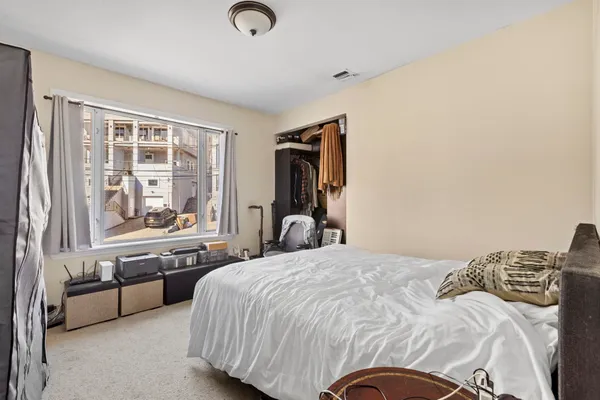 a bathroom with a granite countertop sink toilet a mirror and shower