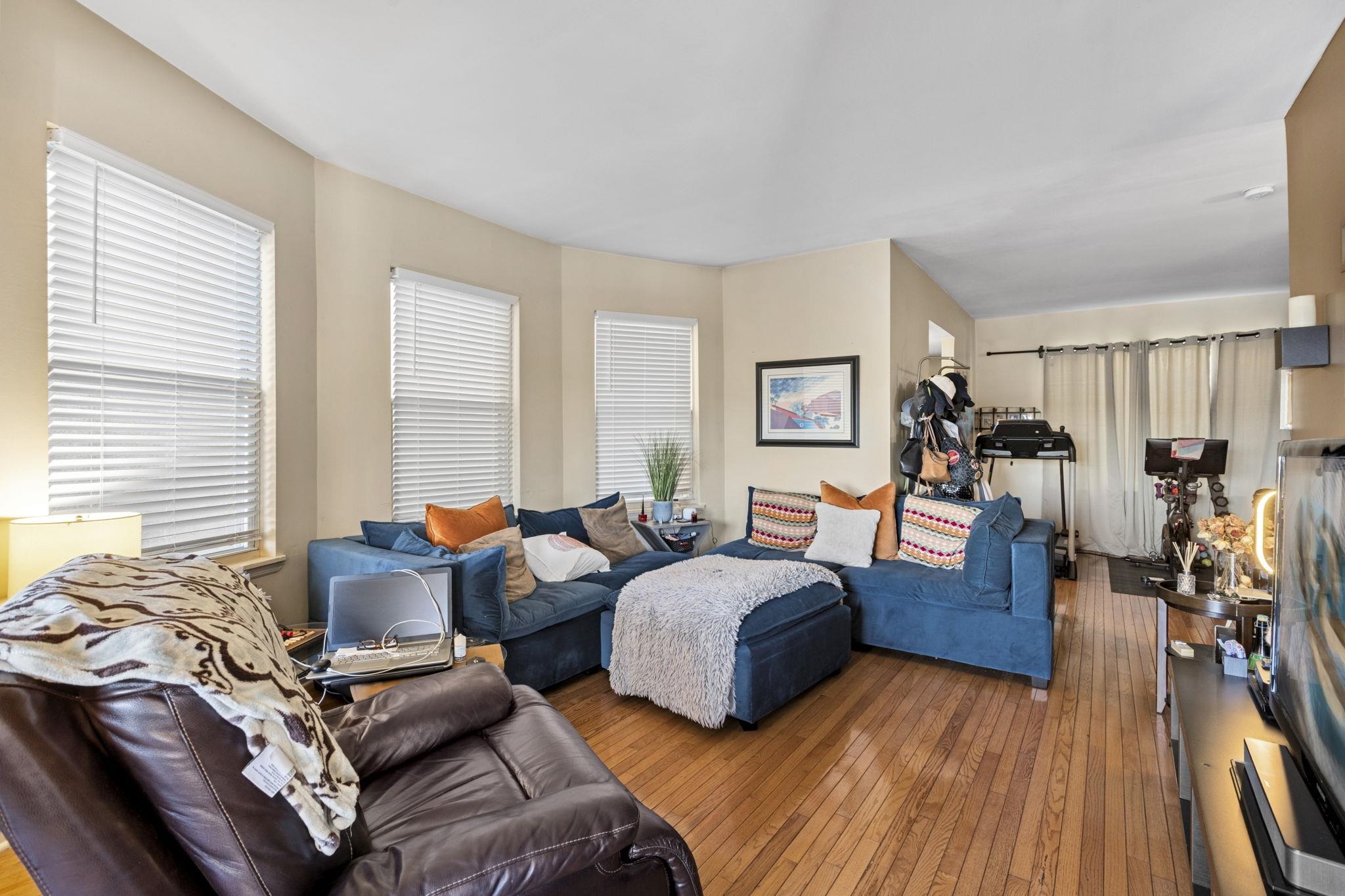 67 Highway 5 Edgewater, NJ 07020 - Photo 6 of 23 a bedroom with two beds and a large mirror next to a window
