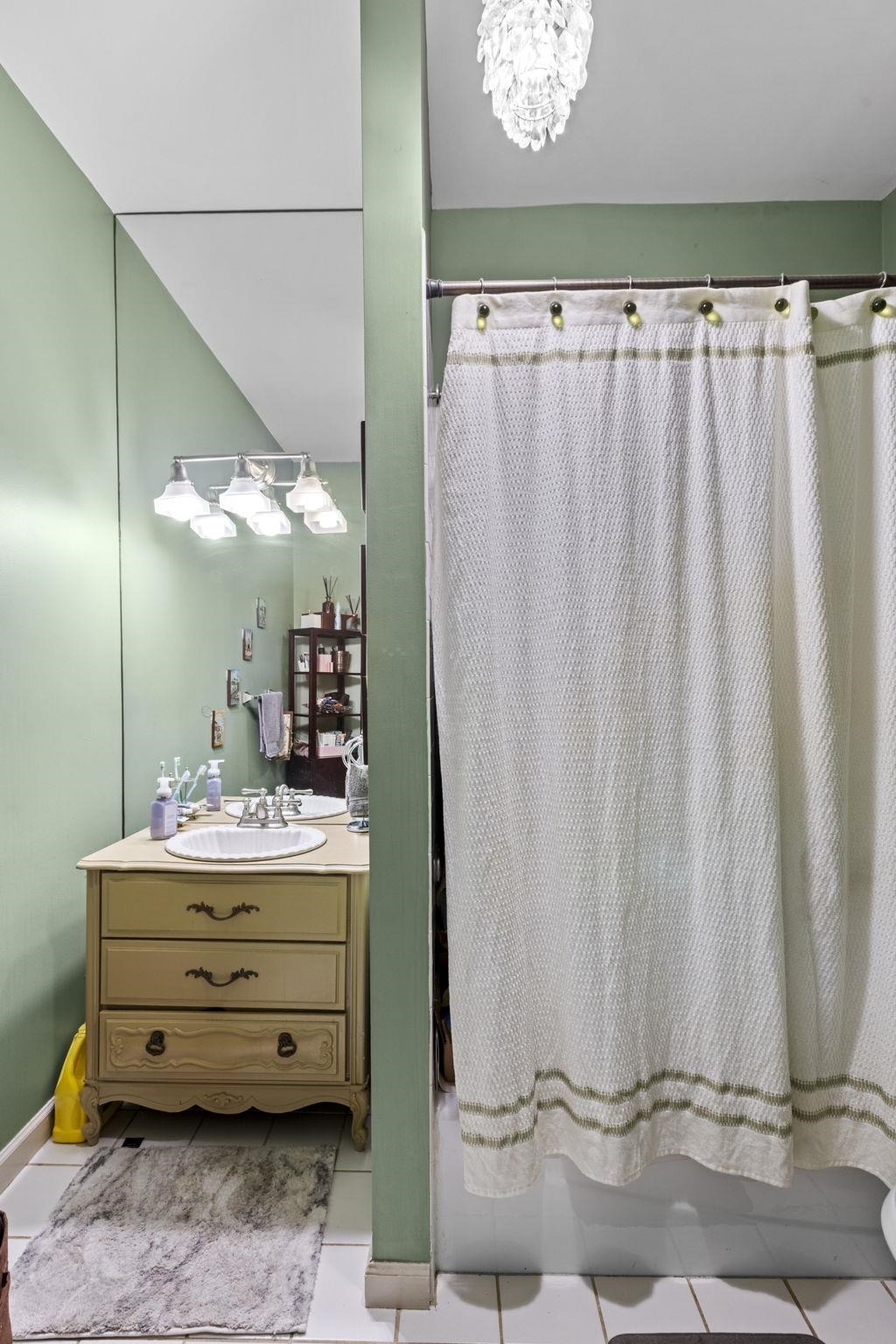 67 Highway 5 Edgewater, NJ 07020 - Photo 8 of 23 a room with a mirror and a curtain