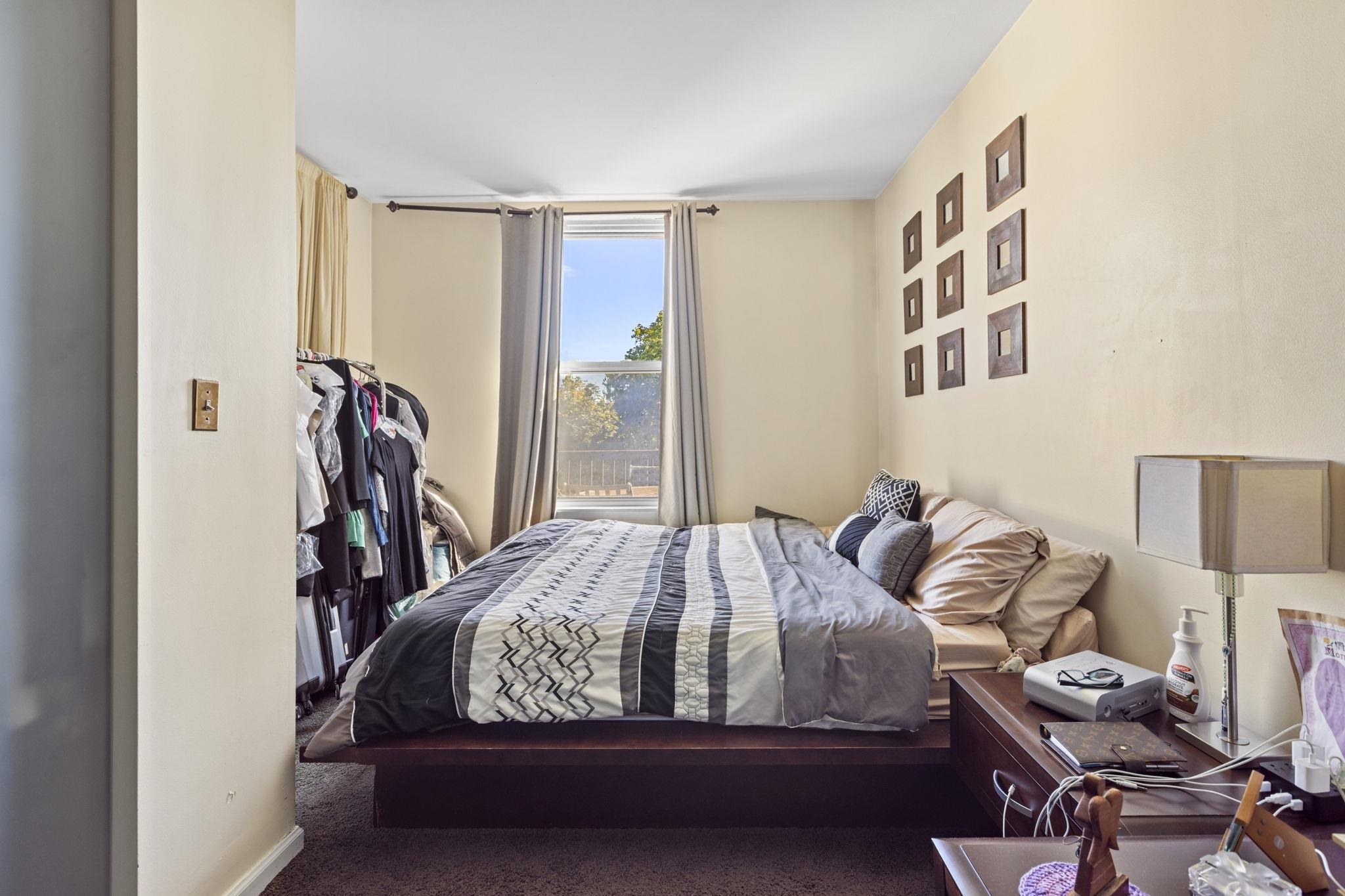 67 Highway 5 Edgewater, NJ 07020 - Photo 9 of 23 a bedroom with bed and a window