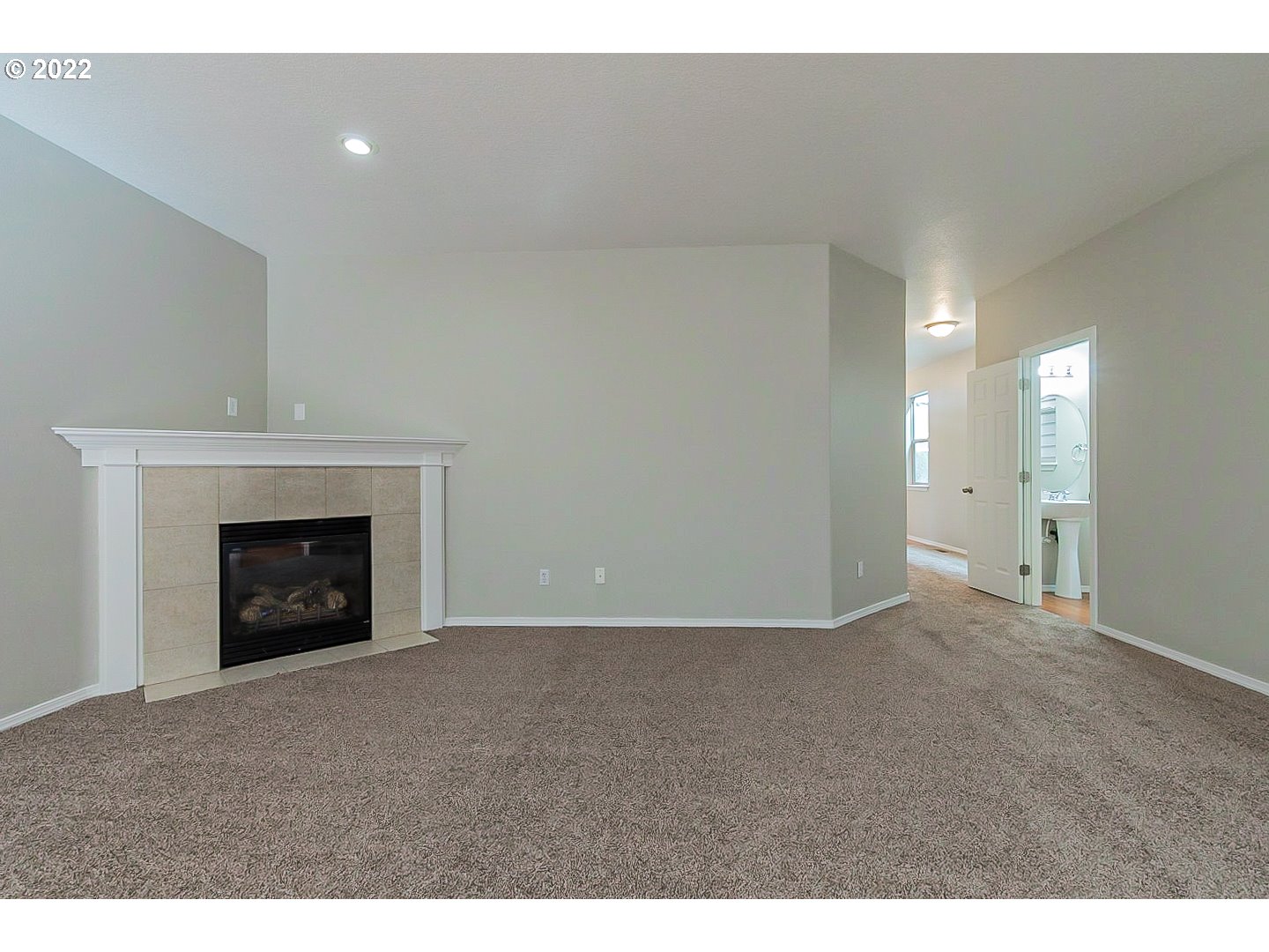 20008 Southwest Jette Lane Beaverton, OR 97003 - Photo 11 of 32 a view of an empty room with a fireplace