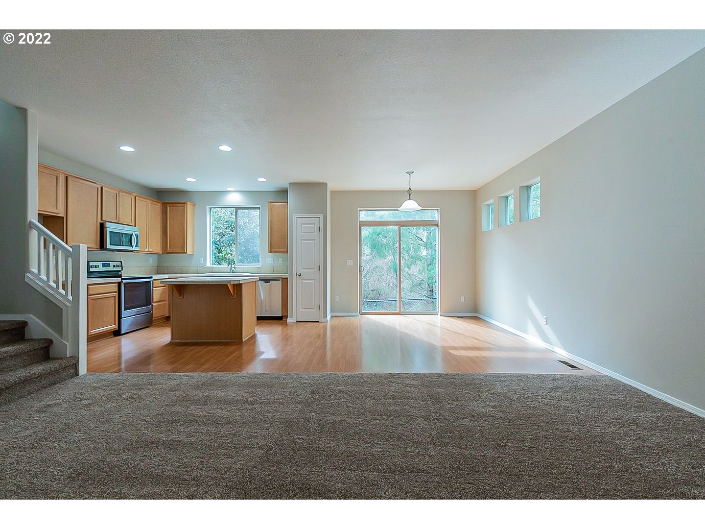 20008 Southwest Jette Lane Beaverton, OR 97003 - Photo 6 of 32 a view of kitchen and hall with wooden floor