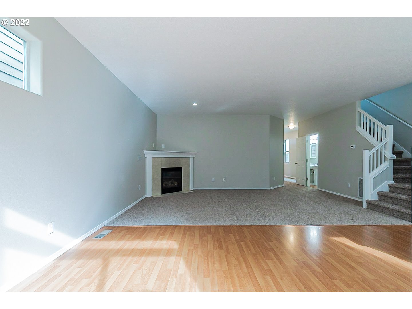 20008 Southwest Jette Lane Beaverton, OR 97003 - Photo 10 of 32 a view of an empty room with a fireplace and a window