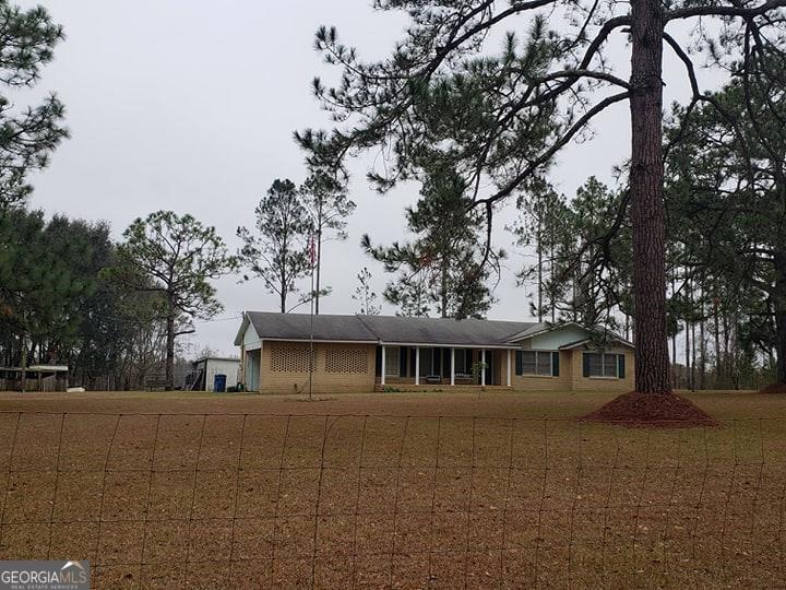 659 Causey Road Baxley, GA 31513 - Photo 1 of 1 a front view of a house with a tree
