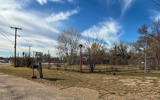 a big yard with large trees