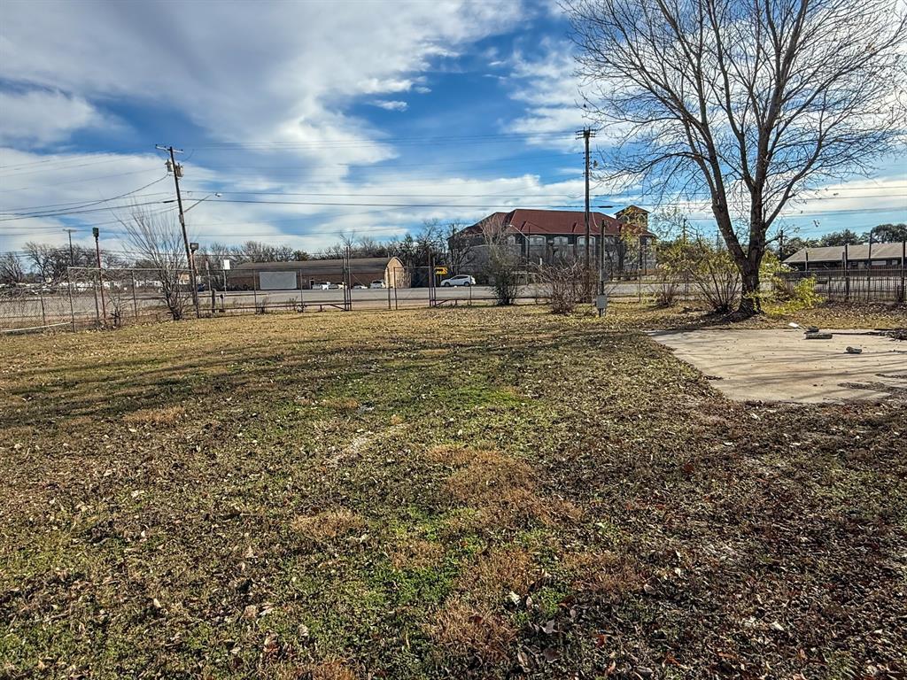 1709 North Main Street Cleburne, TX 76033 - Photo 9 of 14 a view of a lake with houses
