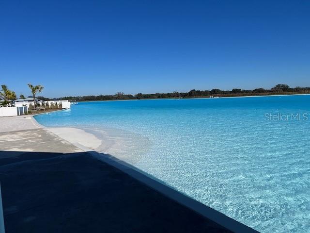 10373 Lavender Aster Trail San Antonio, FL 33576 - Photo 29 of 34 a view of a lake next to a lake