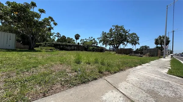 a view of a patio with a yard