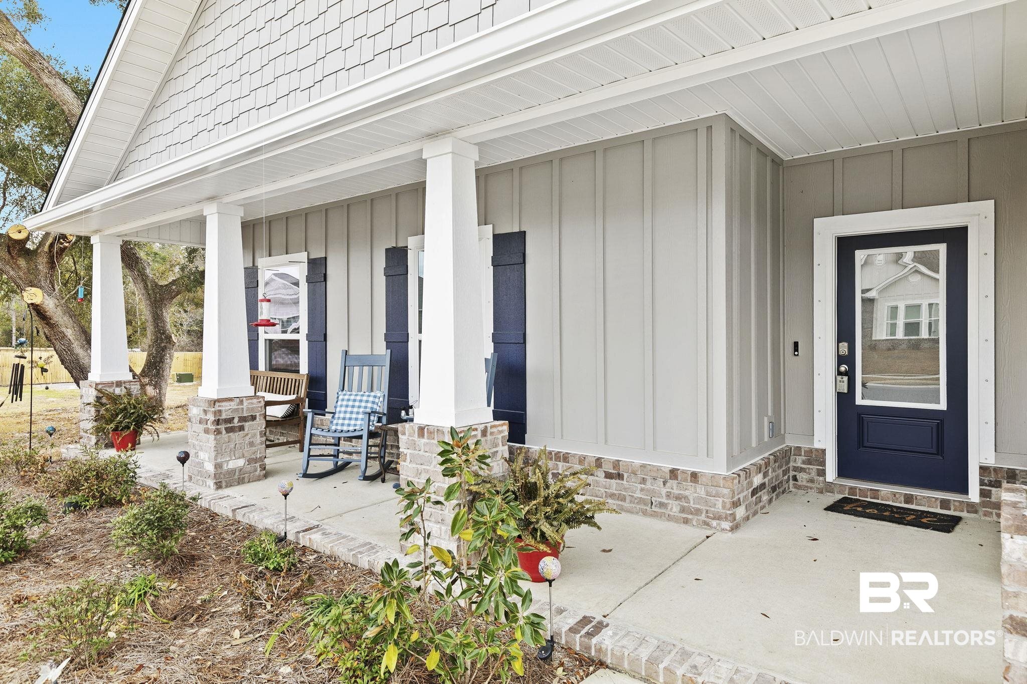 1141 Pencarro Boulevard Foley, AL 36535 - Photo 6 of 70 View of exterior entry with a porch