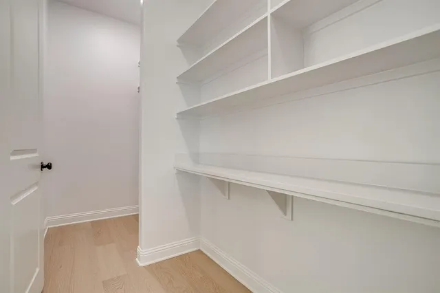 a view of an empty walk in closet