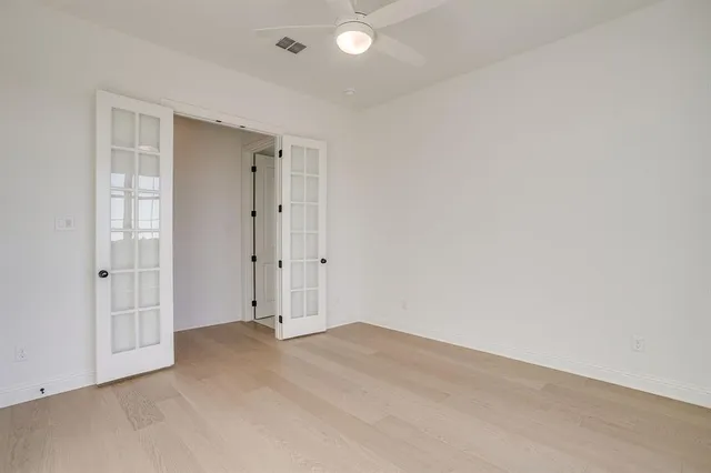 an empty room with closet area