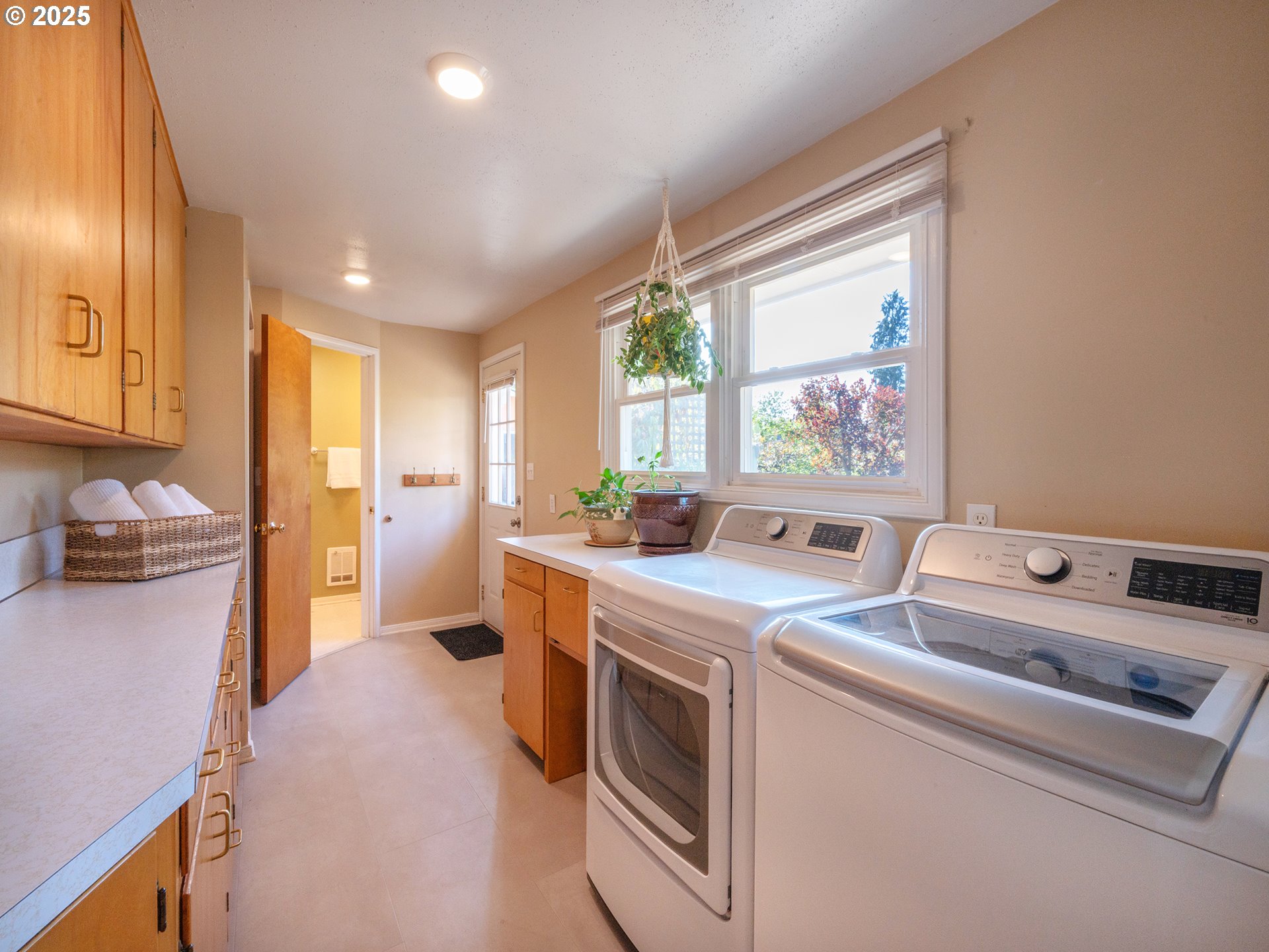 464 Spring Creek Drive Eugene, OR 97404 - Photo 14 of 45 a kitchen that has a sink cabinets counter space and a window