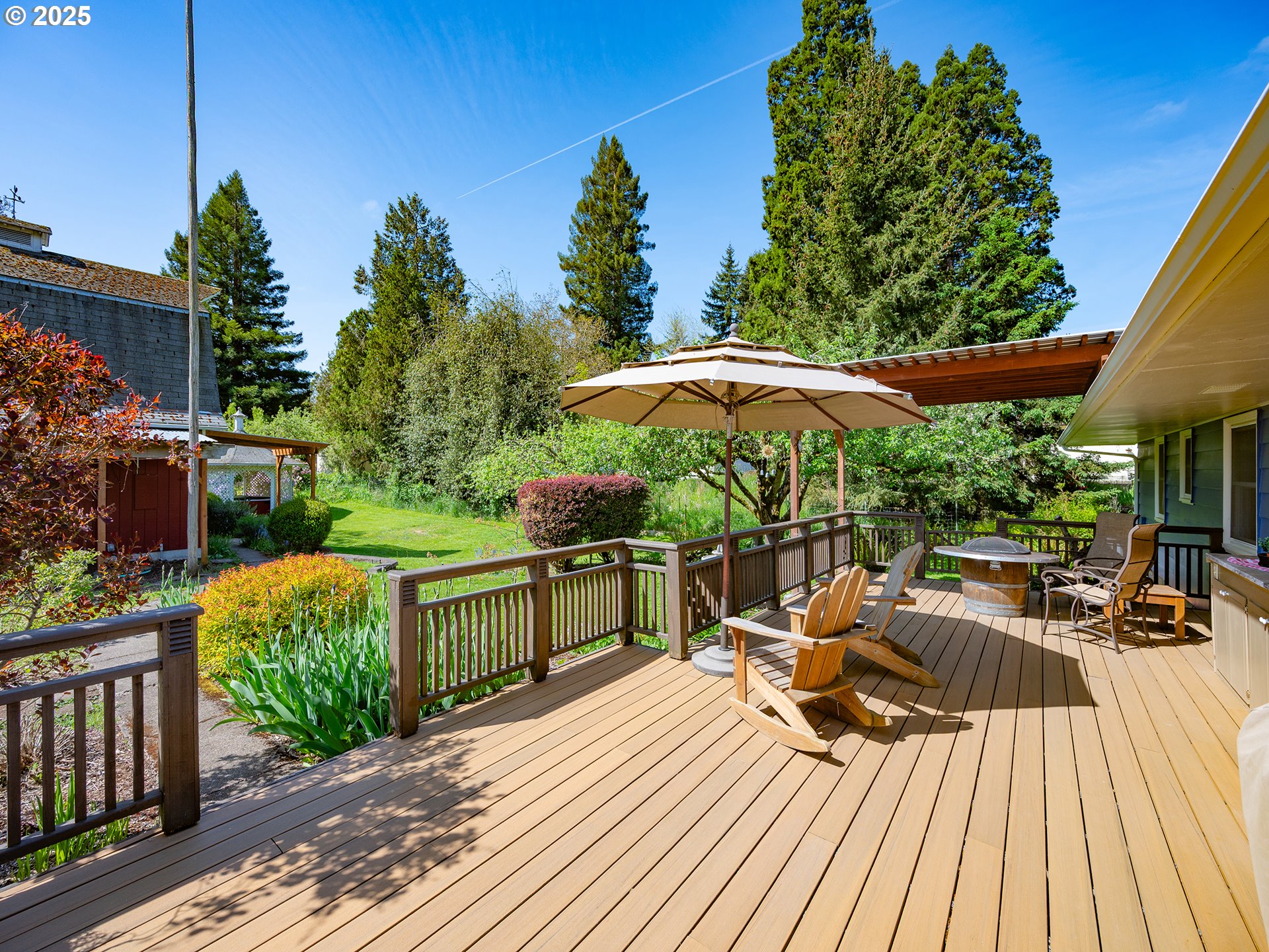464 Spring Creek Drive Eugene, OR 97404 - Photo 17 of 45 an outdoor space with furniture and umbrella