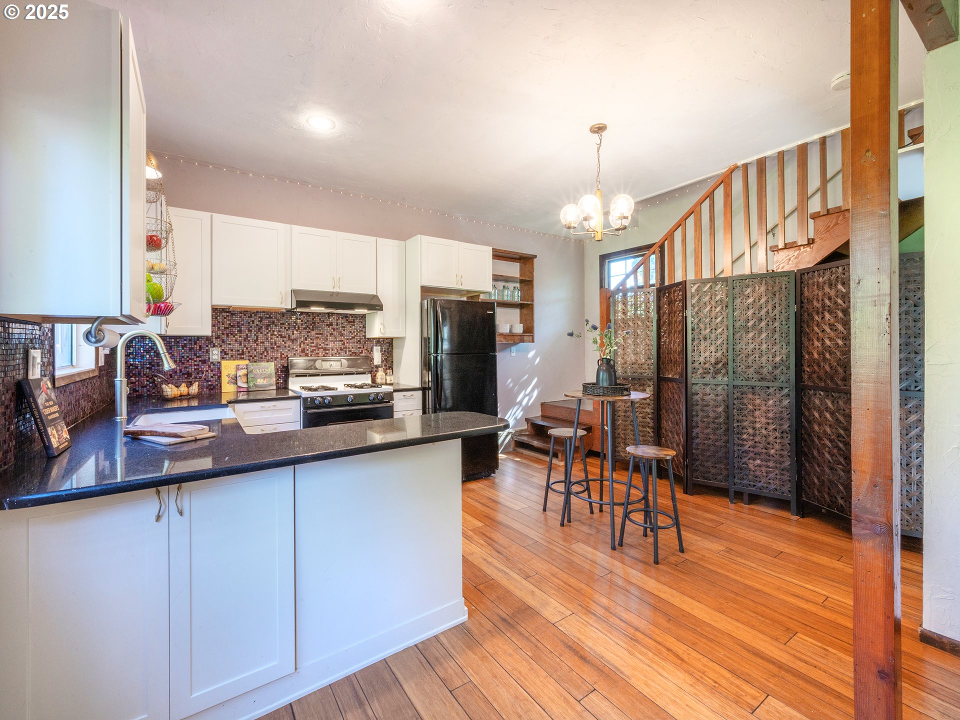 464 Spring Creek Drive Eugene, OR 97404 - Photo 25 of 45 a kitchen with stainless steel appliances wooden floor and refrigerator