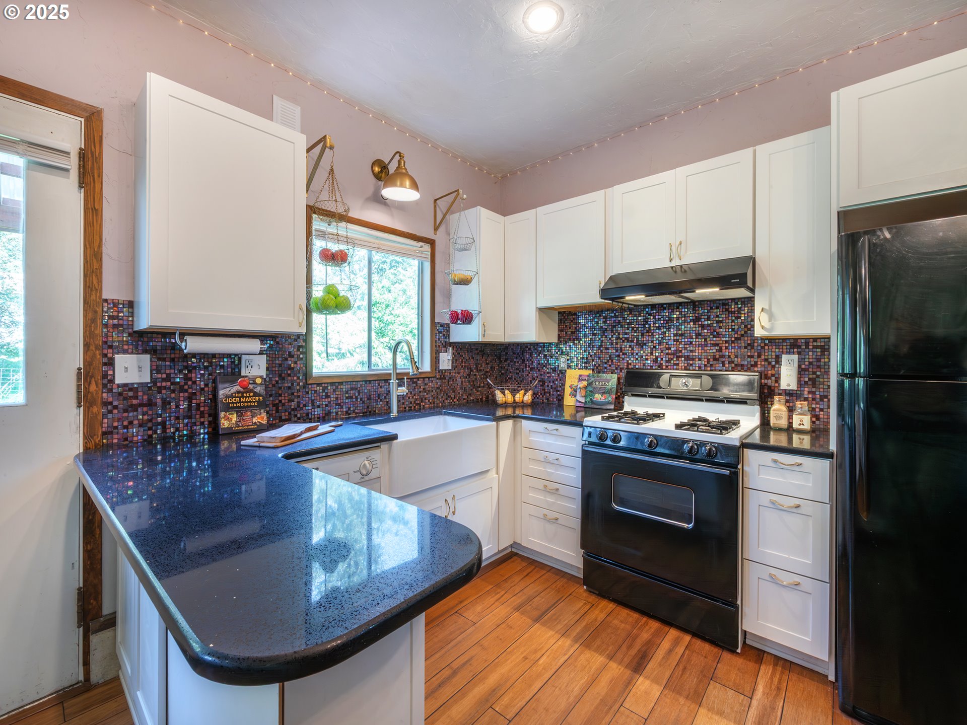 464 Spring Creek Drive Eugene, OR 97404 - Photo 26 of 45 a kitchen with stainless steel appliances granite countertop a sink stove and refrigerator