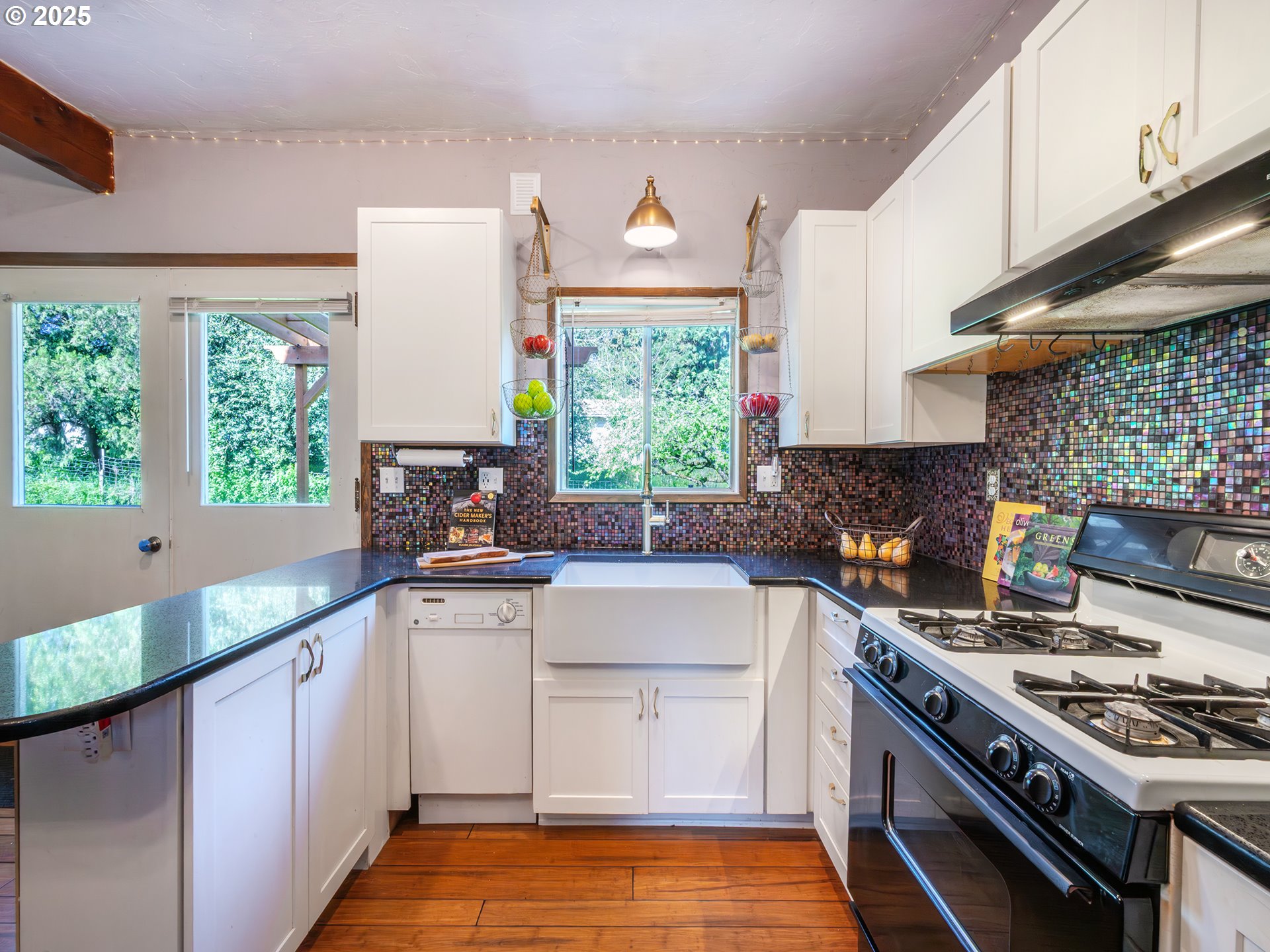 464 Spring Creek Drive Eugene, OR 97404 - Photo 27 of 45 a kitchen with a stove a sink and a window